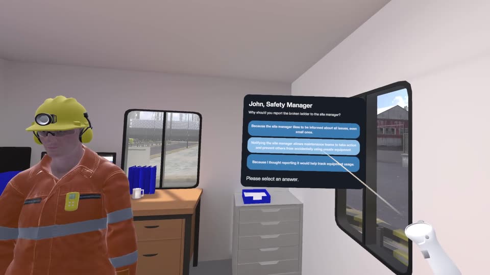 The safety manager in a site office asking a multiple-choice question