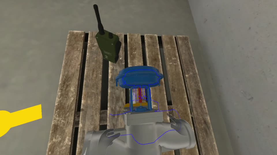 A blue control valve resting on a wooden pallet